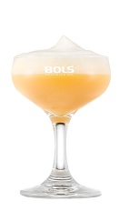 The Banana Coupe is a festive yellow Christmas drink made from advocaat egg liqueur, lemon juice, simple syrup and Bols Banana Foam liqueur, and served in a chilled cocktail glass.