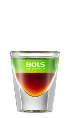 The Shit on the Grass is a layered brown and green shot perfect for any spring or summer party. Made from coffee liqueur and melon liqueur, and served in a chilled shot glass.