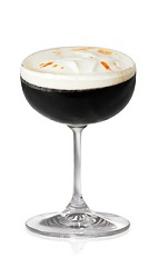 The Domino is a black cocktail made from Patron tequila, Patron XO Cafe liqueur, heavy cream and orange bitters, and served in a chilled cocktail glass or champagne coupe.