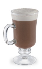 The Vanilla Cinco is a brown drink made from vanilla liqueur and cappuccino, and served in a warm Irish coffee glass.