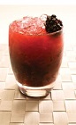 The Blackberry Caipirinha is a dark red colored drink recipe made with Leblon cachaca, blackberries, sugar and lime juice, and served muddled in a rocks glass full of crushed ice.
