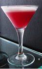 The Effen Flower is a romantic red colored cocktail made from Effen raspberry vodka, St-Germain elderflower liqueur, sour mix, simple syrup and egg white, and served in a chilled cocktail glass.