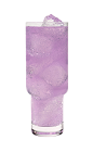 The Harmonie Paloma is a purple drink made from Hpnotiq Harmonie, tequila, ruby red grapefruit juice and club soda, and served over ice in a highball glass.