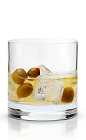 The New Dirty Martini is a modern variation of the classic Dirty Martini cocktail. Made from New Amsterdam vodka, dry vermouth, olive brine and olives, and served over ice in a rocks glass.