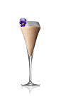 The Sunset Peak is a cream colored drink made from Amarula cream liqueur, crushed ice, violet syrup and whiskey, and served in a chilled champagne flute.