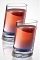 The Twisted Tomfoolery shot is a red colored drink made from Seagram's Red Berry Twisted gin, raspberry schnapps, blue curacao and lemon-lime soda, and served in a shot glass.